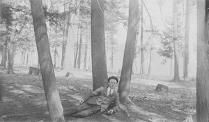 William J. Fahey, Jr. laying outdoors, in forest
