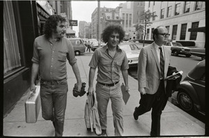 Abbie Hoffman and George Kimball walking along the street