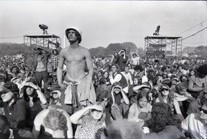 May Day concert and demonstrations: man wearing helmet standing in audience