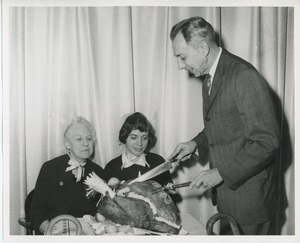 Mr. Burrows carving turkey for clients