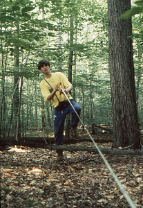 Jonah C. Wittkamper, Class of 1997, reeling up measuring tape in Permanent Plot 1121.