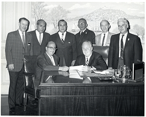 Mayor John F. Collins with seven unidentified individuals