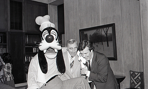 Men with Disney character Goofy