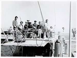 Christine Jorgensen Poses on a Boat with Eight Others