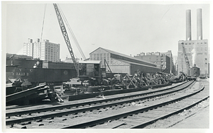 Cutting and loading steel from Atlantic Avenue Elevated, old Kneeland Street Pass Station in rear used as B&A front house