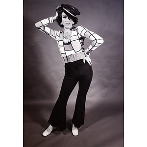 Abe Rybeck wearing a hat and 70s attire for a play