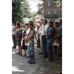 Carmen Pola and Mayor Thomas Menino stand in a group of people at a park event