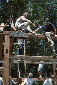 Hank Art (left) and Lauren Stevens (right) setting a rafter at the Moon Barn Raising at entrance to Hopkins Forest on 2 August 1975.