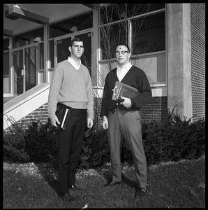 Greg Landry (quarterback, left) and Jim Mitchell (tackle), UMass Amherst football co-captains for 1967-1968, outside of Boyden Gymnasium