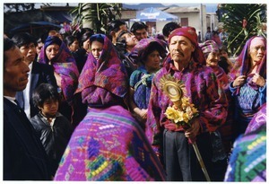 Man and woman at head of funeral procession and Fiesta de Ano Nuevo celebration