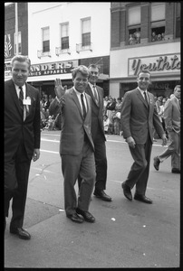 Robert F. Kennedy and entourage walking past the Youthtown store, Worthington, during the Turkey Day festivities