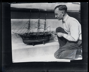 Robert I. Innis with model of the whaling bark, Charles W. Morgan