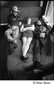 Peter Bellamy, Heather Wood, Royston Wood (l. to r.) of Young Tradition, lying on a bed