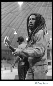 Bob Marley with guitar, awaiting the concert at Meehan Auditorium