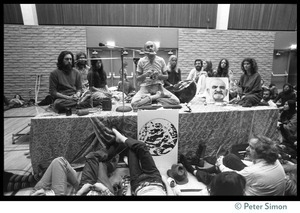 Ram Dass and associates on stage during an appearance at the College of Marin