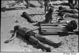 Jungle Beach: Ram Dass splayed on the sand with other beachgoers