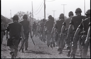 Antiwar demonstration at Fort Dix, N.J.: line of military police advancing, truncheons drawn (from rear)