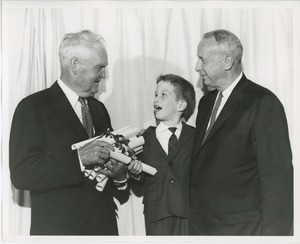 Dr. Carroll V. Newsom and Mr. Bruce Barton with young client at graduation exercises