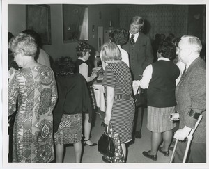 Actor Ken Howard signing autographs for clients at Thanksgiving celebration