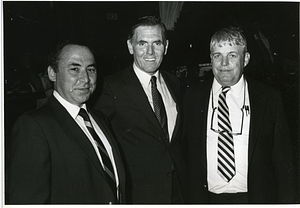 Mayor Raymond L. Flynn standing between two unidentified men