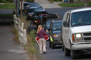 Protest against a pornographic video store in Northampton: protester handing out fliers to cars on North Street