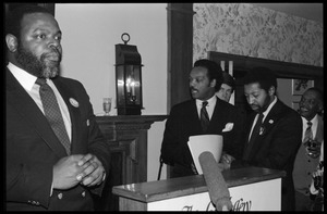 Jesse Jackson preparing to address the crowd, with Bill Strickland (immediately to right of Jackson)