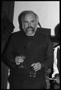 Robert H. Abel, holding drinks, at the book party for Robert H. Abel