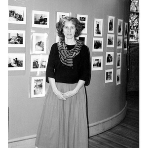 Carlota Duarte in front of her photographs.