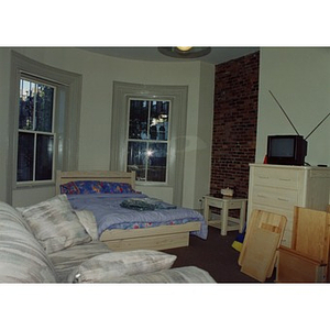 Furnished room in Villa Victoria housing.