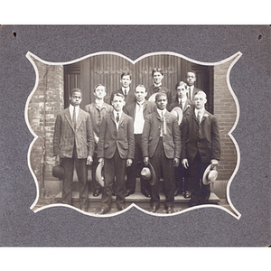 Group photograph, ten young men on stoop