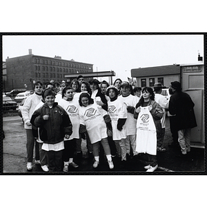 Boys and Girls Club members wearing the Club t-shirts, posing together outside