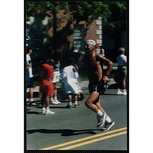 A man runs in the Battle of Bunker Hill Road Race