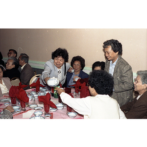 Guests drinking tea during Chinese Progressive Association's 15th Anniversary Celebration