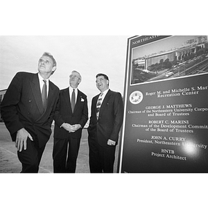 President Curry, Chairman Matthews (center), and alumni donor Roger Marino on the site of the new recreation center