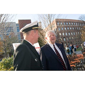 Vice Admiral Mark Fitzgerald and Neal Finnegan converse at the Veterans Memorial dedication