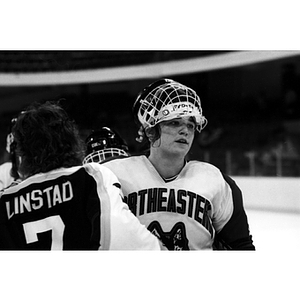 Three players on the ice during a Northeastern vs. Providence College women's ice hockey game