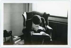 Mark Sommer seated reading