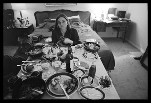 Judy Collins: horsing around after a meal, seated at a dinner table set up in her room at the Beverly Hills Hotel