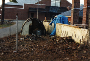 The quonset hut, cinder block wall and brick chimney-like kilns are all that remains of the destruction of the back room of Munson Annex and the fenced-in area