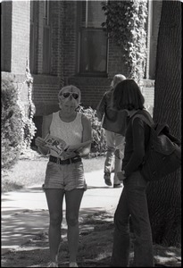 Young woman reading copy of Free Spirit Press magazine