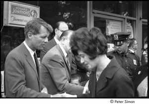 Robert F. Kennedy greeting a woman