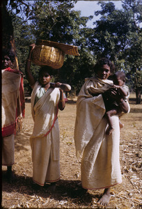 Three young Munda women with an infant in the Ranchi district