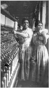 Two female textile workers at a spinning frame. [05]