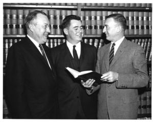 Suffolk University Dean Frederick A. McDermott (Law), Lawrence Cameron, and student at a campus event