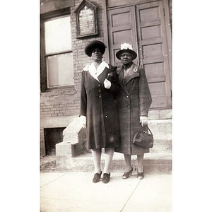 Lillian Irish poses with woman in front of St. Michael and All Saints Church on Ruggles Street