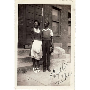 Phyllis and Michael E. Haynes pose in front of a church on Ruggles Street