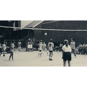 Women playing volleyball.
