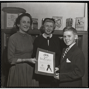 William Martin receives a certificate from the Boys' Clubs of America Junior Book Awards Program