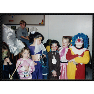 Children pose in their Halloween costumes