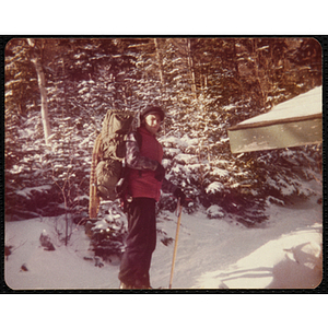 A teenage girl poses for a shot while cross-country skiing